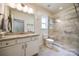 Spacious bathroom with granite countertops, white cabinets, and glass-enclosed shower at 2470 Highway 557 Rd, Clover, SC 29710