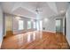 Large bedroom with hardwood flooring, tray ceiling, walk-in closet, and ensuite bathroom with laundry at 2470 Highway 557 Rd, Clover, SC 29710