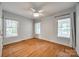 Well-lit bedroom featuring hardwood floors, neutral walls, and windows with natural lighting and privacy at 2470 Highway 557 Rd, Clover, SC 29710