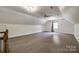Large bonus room featuring hardwood floors and natural light from a window at 2470 Highway 557 Rd, Clover, SC 29710