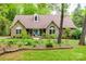Charming brick home featuring a well-maintained lawn and manicured landscaping at 2470 Highway 557 Rd, Clover, SC 29710