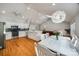 Open-concept kitchen and dining area with white cabinets, hardwood floors, and stainless steel appliances at 2470 Highway 557 Rd, Clover, SC 29710