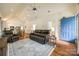 Inviting living room with wood floors, plush seating, and lots of natural light at 2470 Highway 557 Rd, Clover, SC 29710