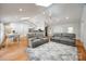 Spacious living room with vaulted ceilings, skylights, hardwood floors, and modern decor at 2470 Highway 557 Rd, Clover, SC 29710
