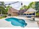 Inviting pool area with hot tub, lounge chairs, and adjacent deck, perfect for entertaining and relaxation at 2470 Highway 557 Rd, Clover, SC 29710