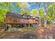 Expansive home exterior with a multi-level deck, patio, and well-maintained backyard space at 252 Greyfriars Rd, Mooresville, NC 28117