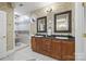 Bathroom features a double vanity with granite counters and a walk-in shower with a tiled surround at 252 Greyfriars Rd, Mooresville, NC 28117