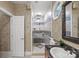 Bathroom featuring a walk-in shower with dual shower heads, seat, and a granite-topped vanity at 252 Greyfriars Rd, Mooresville, NC 28117
