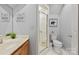Bathroom features a single sink vanity and walk-in shower with glass doors at 252 Greyfriars Rd, Mooresville, NC 28117