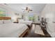 Bright bedroom with hardwood floors, ceiling fan, and balcony access at 252 Greyfriars Rd, Mooresville, NC 28117