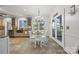Cozy breakfast nook featuring natural light, white chairs and table, and access to the outdoor at 252 Greyfriars Rd, Mooresville, NC 28117