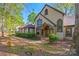 A beautifully landscaped yard leads to this inviting home with a stone-accented entrance and arched windows at 252 Greyfriars Rd, Mooresville, NC 28117