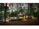 Stunning two-story home with a beautifully landscaped yard surrounded by mature trees and waterfront access at 252 Greyfriars Rd, Mooresville, NC 28117