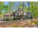 Charming two-story home featuring a well-manicured front yard with lush greenery and mature trees at 252 Greyfriars Rd, Mooresville, NC 28117