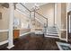 Spacious foyer featuring a grand staircase, beautiful hardwood floors, and elegant design at 252 Greyfriars Rd, Mooresville, NC 28117