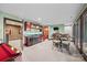 Game room features a kitchenette, an eat-in table, and a doorway to an adjacent room at 252 Greyfriars Rd, Mooresville, NC 28117