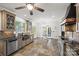 Open kitchen featuring granite countertops, stainless appliances, and a breakfast nook with water views at 252 Greyfriars Rd, Mooresville, NC 28117