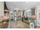 Updated kitchen with granite countertops, stainless steel appliances, and tile floors at 252 Greyfriars Rd, Mooresville, NC 28117