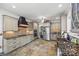 Spacious kitchen with granite counters, stainless appliances, custom cabinetry, and tiled backsplash at 252 Greyfriars Rd, Mooresville, NC 28117