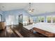 Large main bedroom with hardwood floors, vaulted ceilings, and private access to an outdoor deck at 252 Greyfriars Rd, Mooresville, NC 28117