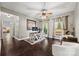 Well-lit home office with hardwood floors, ceiling fan, and scenic views from large windows at 252 Greyfriars Rd, Mooresville, NC 28117
