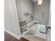 Carpeted staircase leading to a basement with stylish decorations on the landing at 252 Greyfriars Rd, Mooresville, NC 28117