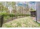 Landscaped backyard with a privacy fence, providing a peaceful retreat within a vibrant community at 2676 Poplar Cove Nw Dr, Concord, NC 28027