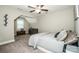 Bright bedroom featuring a decorative tree accent, a large window, a dresser and soft carpet at 2676 Poplar Cove Nw Dr, Concord, NC 28027
