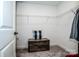 Walk-in closet featuring wire shelving and a wooden storage chest at 2676 Poplar Cove Nw Dr, Concord, NC 28027