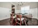 Bright dining room with hardwood floors and decorative wainscoting at 2676 Poplar Cove Nw Dr, Concord, NC 28027