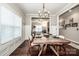 Open-concept dining room leading to a cozy living space and allowing for seamless entertaining at 2676 Poplar Cove Nw Dr, Concord, NC 28027