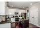 Well-equipped kitchen with granite countertops, stainless steel appliances, and a center island at 2676 Poplar Cove Nw Dr, Concord, NC 28027