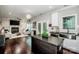Open-concept kitchen and living area with a central island, fireplace, and hardwood floors at 2676 Poplar Cove Nw Dr, Concord, NC 28027