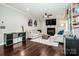 Spacious living room featuring a fireplace, hardwood floors and large windows at 2676 Poplar Cove Nw Dr, Concord, NC 28027