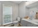 Bright bathroom with a window, vanity with decor, and white toilet at 2945 Christian Scott Ln, Charlotte, NC 28214