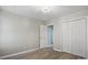 Bright bedroom featuring hardwood floors, a closet, and an adjoining doorway at 2945 Christian Scott Ln, Charlotte, NC 28214