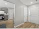 Welcoming foyer with neutral gray walls, luxury vinyl plank flooring, and a view into the kitchen at 2945 Christian Scott Ln, Charlotte, NC 28214