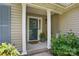 Charming front porch with decorative columns, a potted plant, welcome sign, and an inviting seating area at 2945 Christian Scott Ln, Charlotte, NC 28214