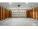 Spacious two-car garage with unfinished walls and an automatic door opener ready for your vehicles and storage needs at 2945 Christian Scott Ln, Charlotte, NC 28214