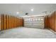 Spacious garage with concrete floors, exposed walls, and an automatic door at 2945 Christian Scott Ln, Charlotte, NC 28214