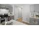 Modern kitchen features gray cabinets, stainless steel appliances, and marble countertops at 2945 Christian Scott Ln, Charlotte, NC 28214