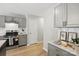 Modern kitchen featuring gray cabinets, stainless steel appliances, and marble countertops at 2945 Christian Scott Ln, Charlotte, NC 28214