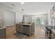 Open kitchen with stainless steel appliances, gray cabinets, and hardwood floors at 2945 Christian Scott Ln, Charlotte, NC 28214
