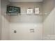 This laundry room has shelving and is ready for your washer and dryer at 2945 Christian Scott Ln, Charlotte, NC 28214
