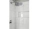 Modern shower with a rain shower head, tiled walls, and a built-in shelf at 2945 Christian Scott Ln, Charlotte, NC 28214
