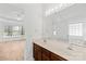 Bathroom features double sink vanity, large mirror, and natural light at 3002 Enderbury Dr, Indian Trail, NC 28079
