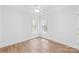 Neutral bedroom with ceiling fan, two windows, and natural light at 3002 Enderbury Dr, Indian Trail, NC 28079
