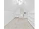 Bright bedroom featuring a ceiling fan, neutral walls, carpeted flooring, and shelving for ample storage at 3002 Enderbury Dr, Indian Trail, NC 28079