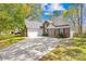 Traditional brick home with attached garage and long driveway at 3002 Enderbury Dr, Indian Trail, NC 28079