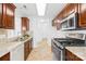 Kitchen featuring granite countertops, stainless steel appliances, and tile flooring at 3002 Enderbury Dr, Indian Trail, NC 28079